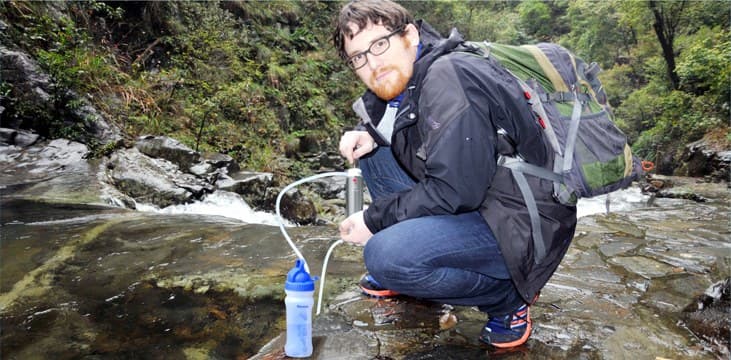 Filtering water from a mountain stream with Diercon bottle